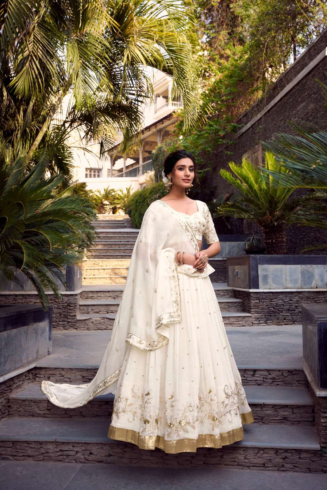 rudraksh lisa glosy off white color silver glosy fabric glam with intricate details lehenga wedding wear rudraksh lisa glosy off white color silver glosy fabric glam with intricate details lehenga wedding wear