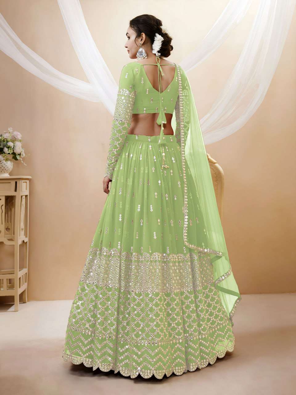 rudraksh a soft pistachio green georgette fabric adorned with delicate zari and sequin butti work sequin work lehenga choli rudraksh a soft pistachio green georgette fabric adorned with delicate zari and sequin butti work sequin work lehenga choli