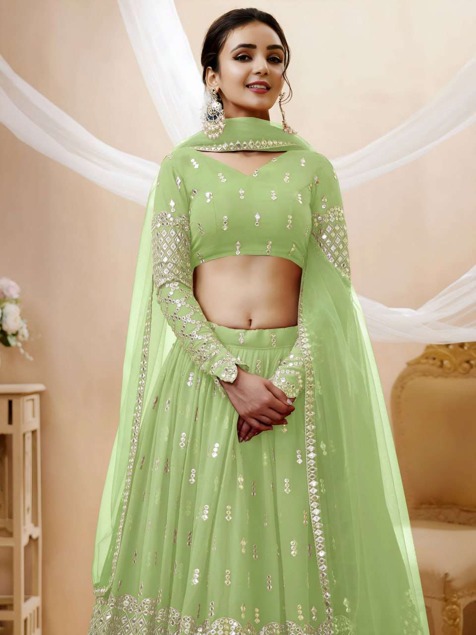 rudraksh a soft pistachio green georgette fabric adorned with delicate zari and sequin butti work sequin work lehenga choli rudraksh a soft pistachio green georgette fabric adorned with delicate zari and sequin butti work sequin work lehenga choli